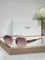 Celine sunglasses with rose-gold frames and purple-tinted lenses