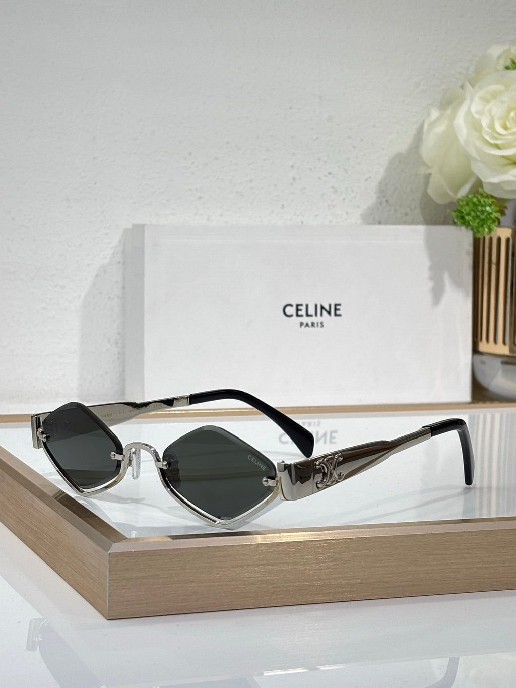 Celine eyeglasses with dark green lenses, gunmetal frame and black temple arms.