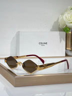 Celine eyeglasses with dark lenses, gold-tone frame and burgundy temple accents.