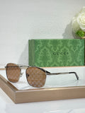 Gucci sunglasses with brown gradient lenses and gold-tone metal frame