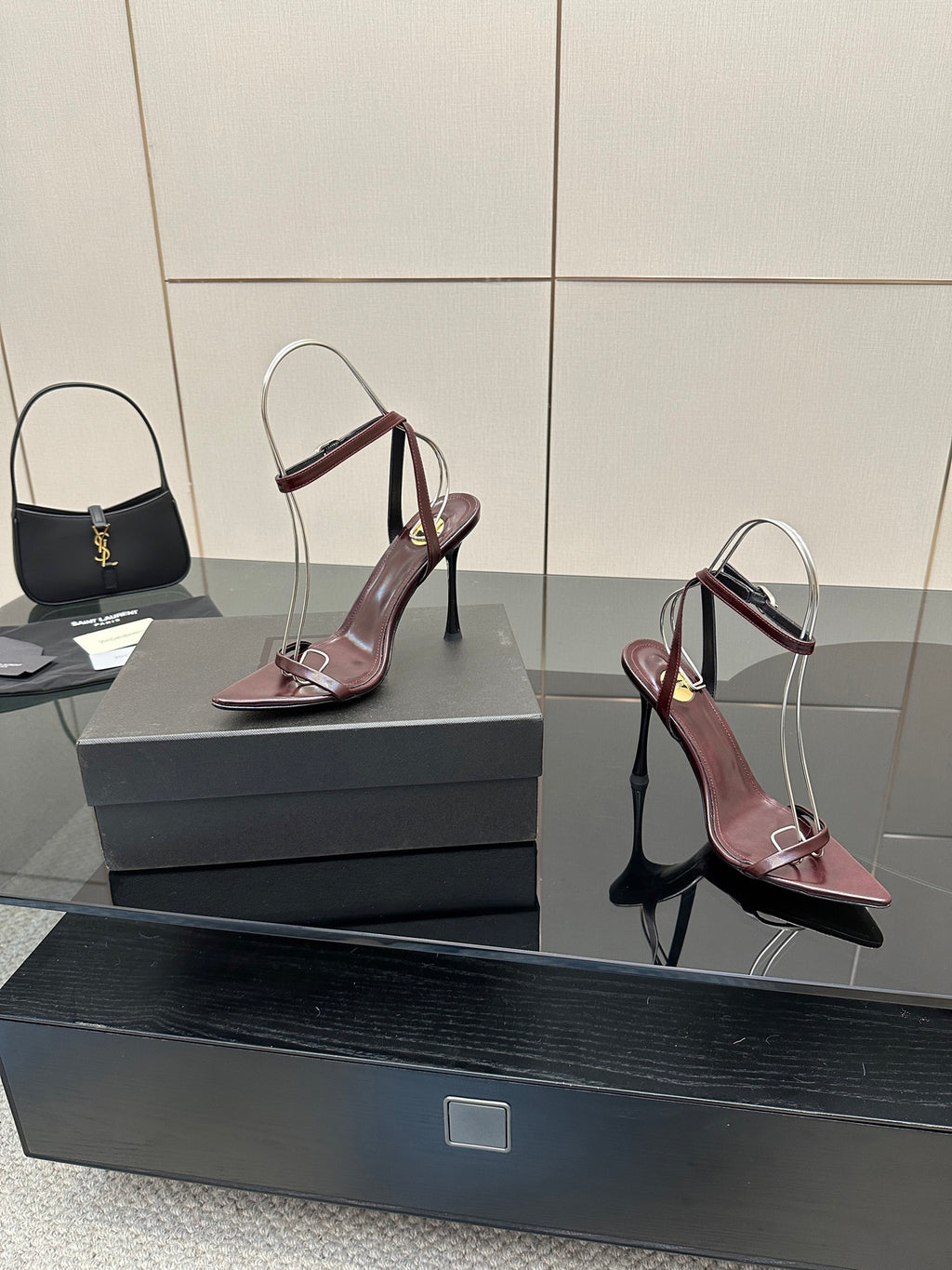 Burgundy pointed-toe strappy high-heel sandals, slingback style with thin stiletto heels
