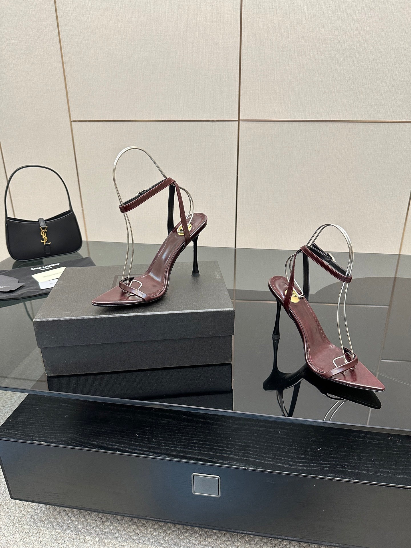 Burgundy pointed-toe strappy high-heel sandals, slingback style with thin stiletto heels