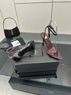 Burgundy strappy high-heel sandals with thin stiletto heels and open toe