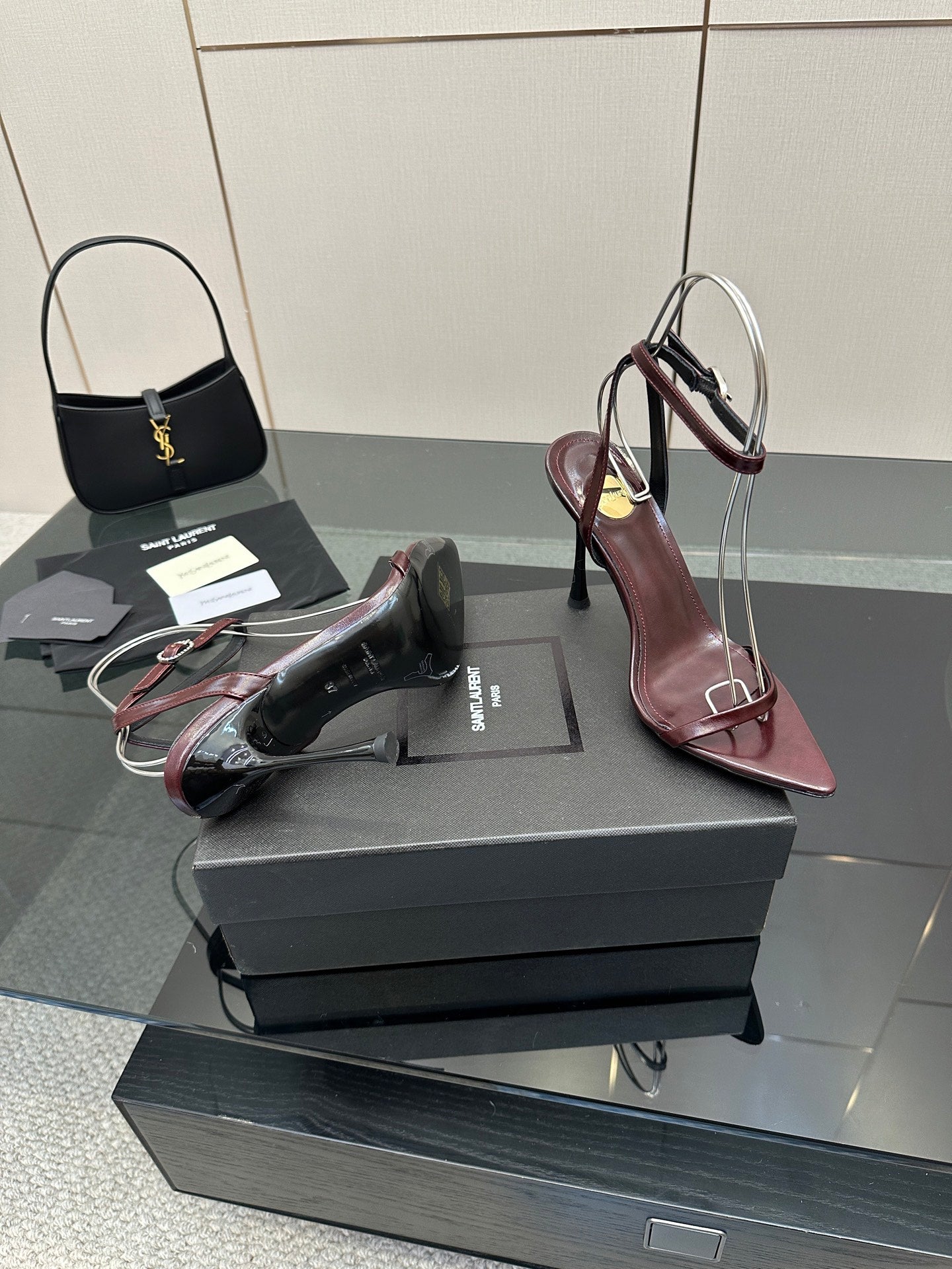 Burgundy strappy high-heel sandals with thin stiletto heels and open toe