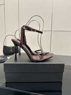 Burgundy strappy high-heel sandal with thin stiletto heel and cross-strap front