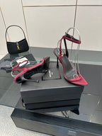 Pink strappy stiletto sandals with black straps and silver wire arch on platform
