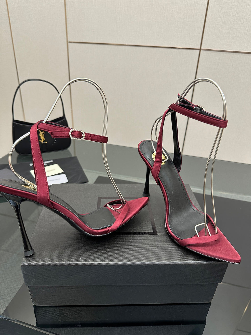 Pink strappy stiletto sandals with ankle strap, black lining, silver wire arch