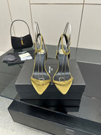 Women’s YSL slingback heeled sandals, yellow pointed toe with black upper and thin heel.