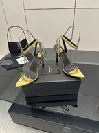 Women’s heeled sandals with yellow toe and strap, black upper, thin stiletto heel.