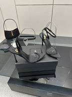 Black women’s high-heel sandals with slingback strap and pointed toe
