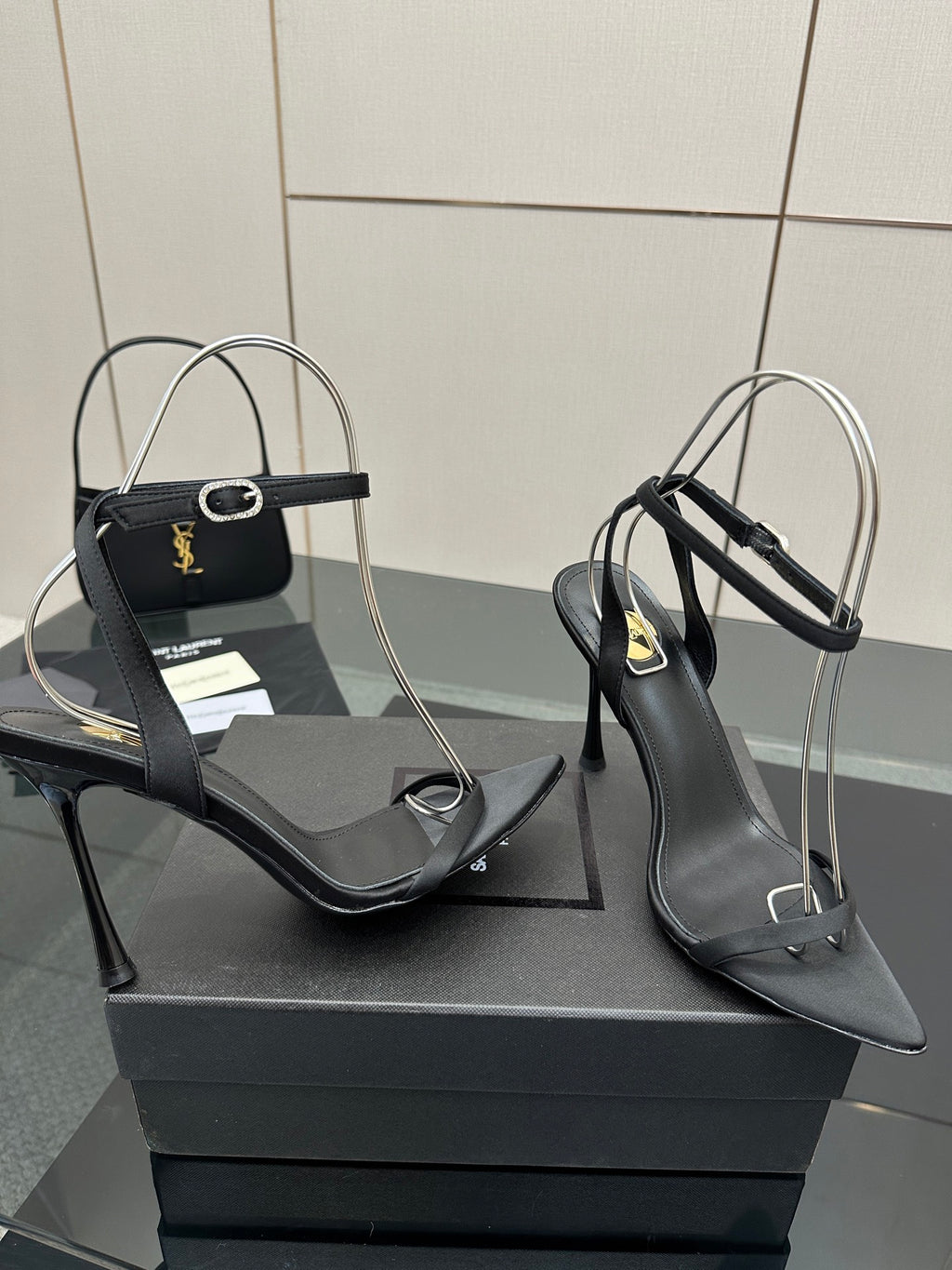 Black women’s high-heel sandals with ankle strap and slim stiletto heel