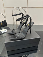 Black women’s high-heel sandals with cross straps and pointed toe, front view