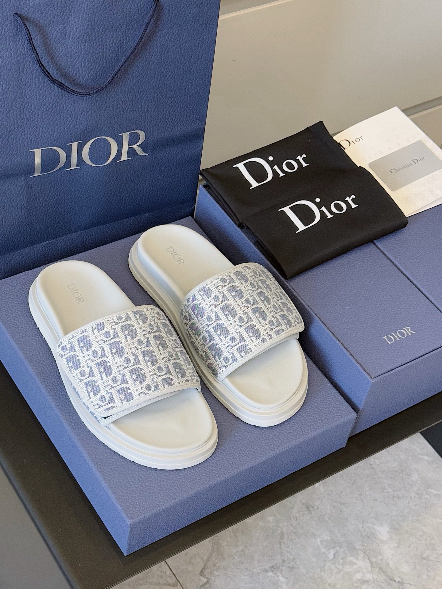 Dior slide sandals on blue box, Oblique-print straps with white footbeds