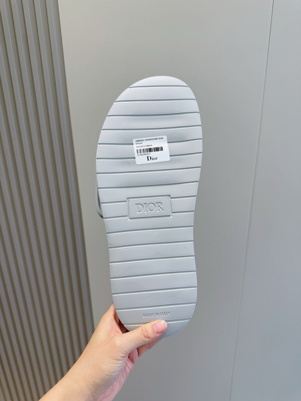 Dior slide sandal outsole, ribbed light sole with Dior branding, viewed from bottom