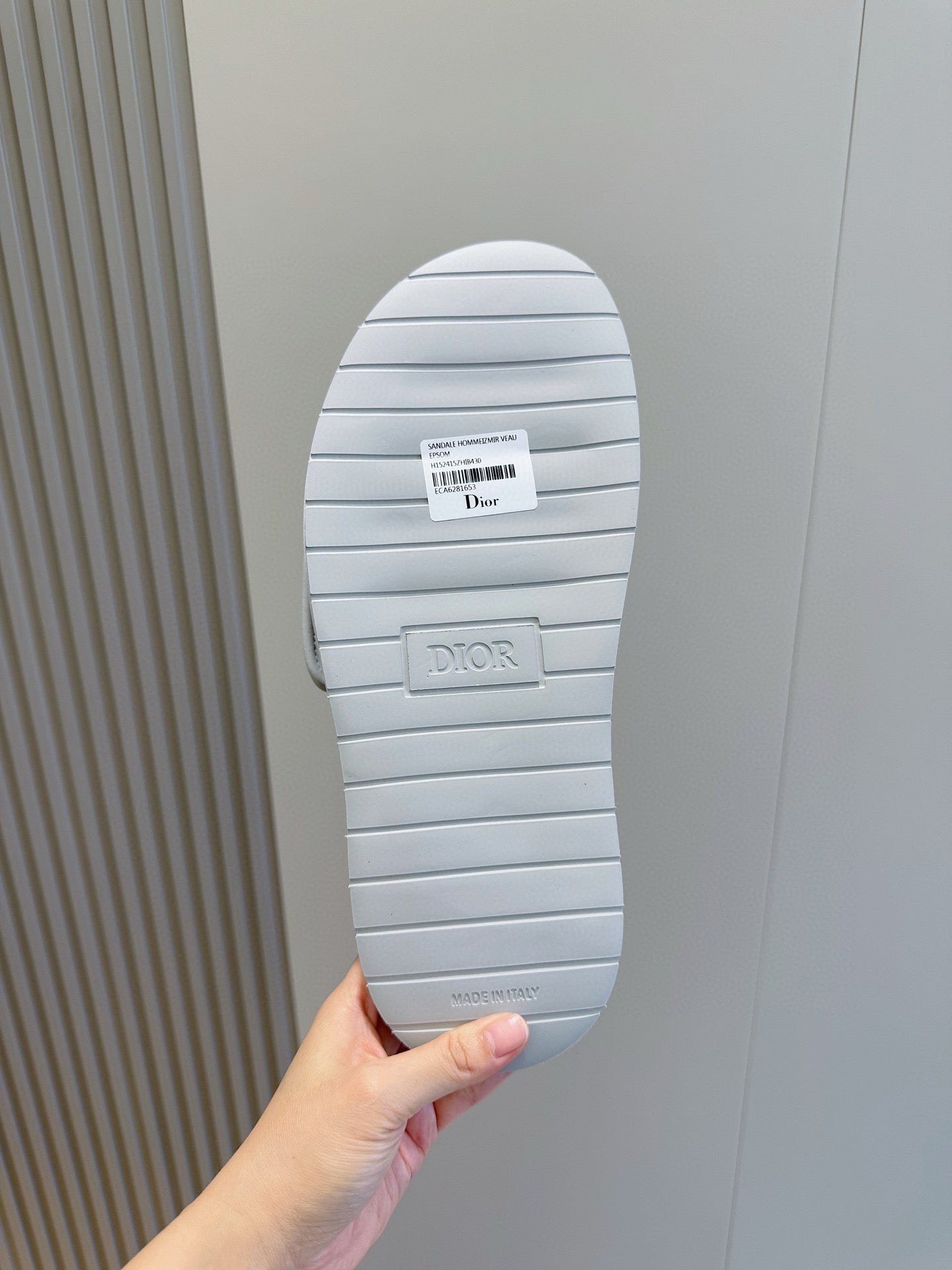 Dior slide sandal outsole, ribbed light sole with Dior branding, viewed from bottom