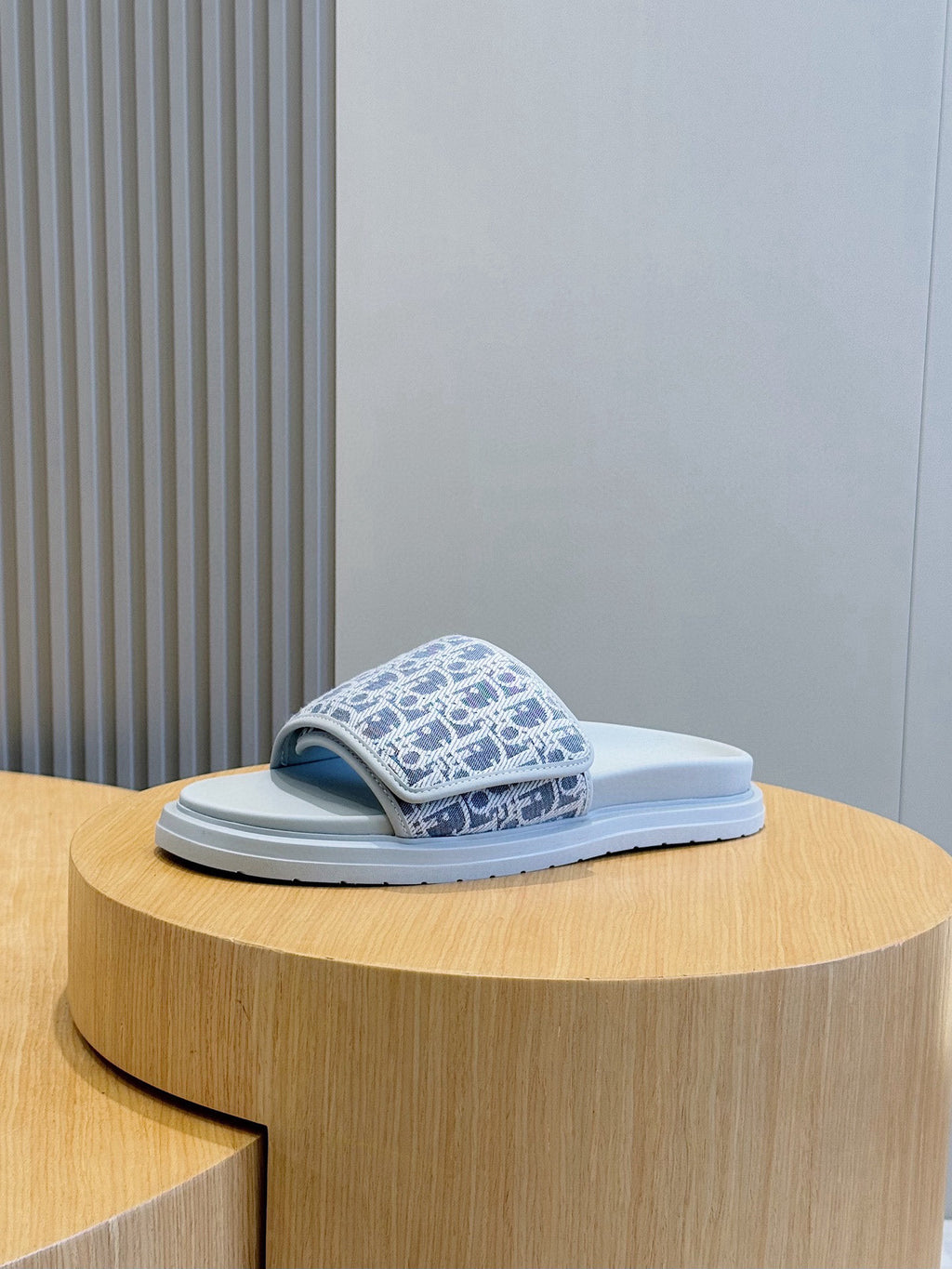Dior slide sandals, single navy Oblique-print strap with light blue sole, side view