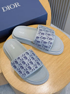 Dior slide sandals on blue Dior box, navy Oblique-print straps and light blue soles