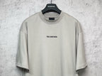 Balenciaga light gray short-sleeve T-shirt with chest logo print, close-up