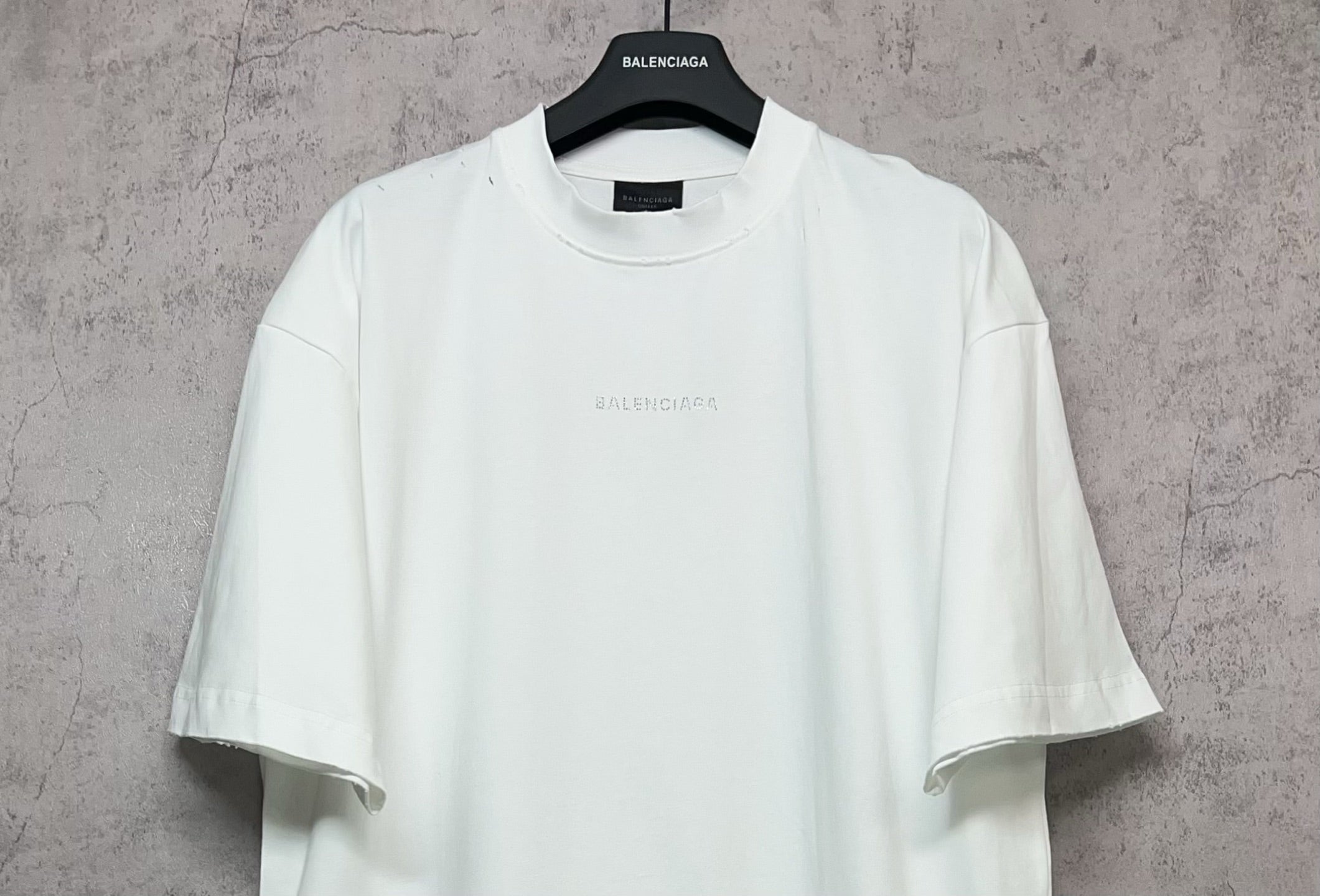 White Balenciaga crew-neck T-shirt with subtle chest print, front