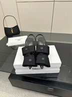 Black mules with toe strap and low block heel, on white Balenciaga box