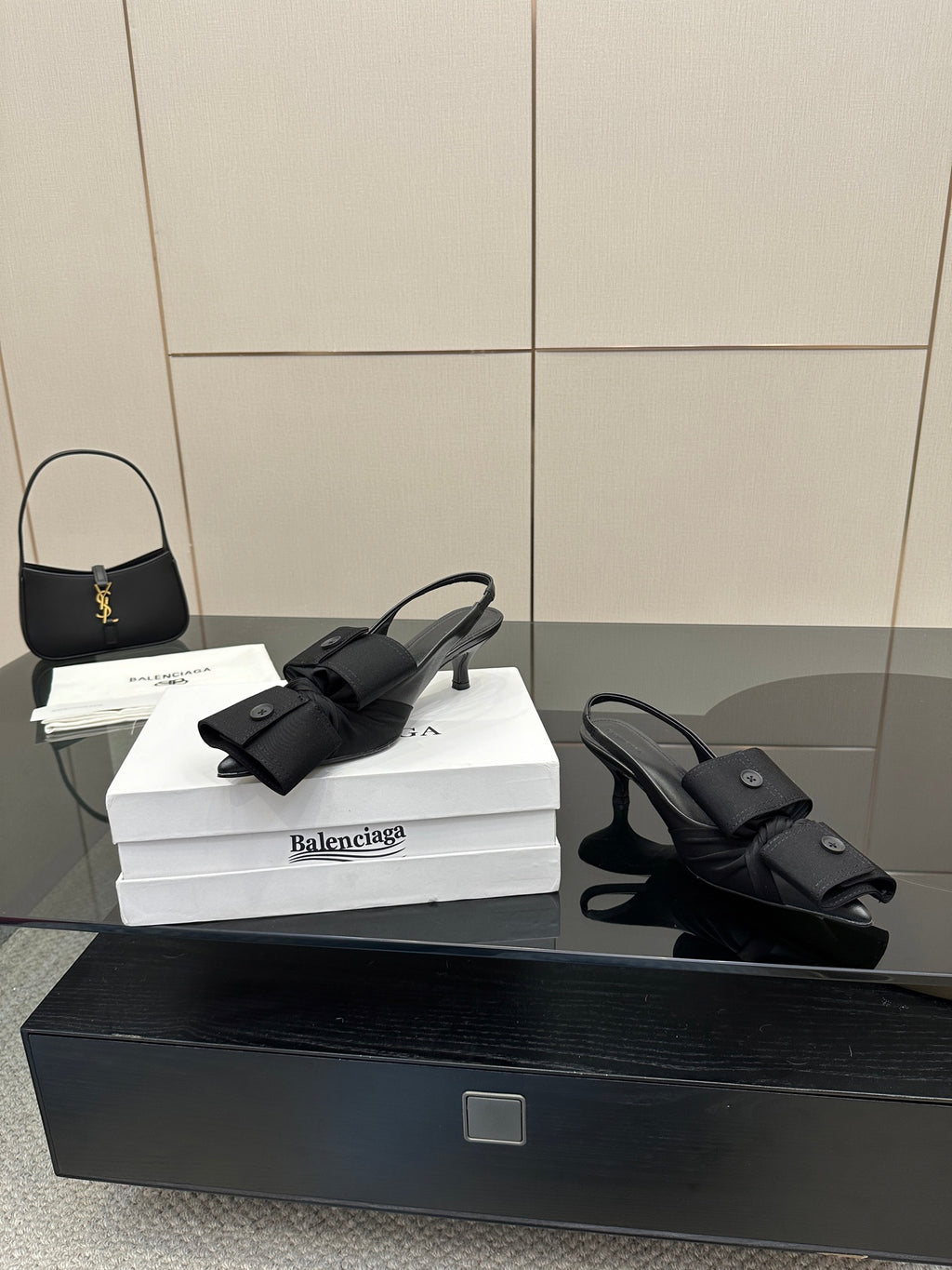 Black mules with toe strap and low block heel, on white Balenciaga box