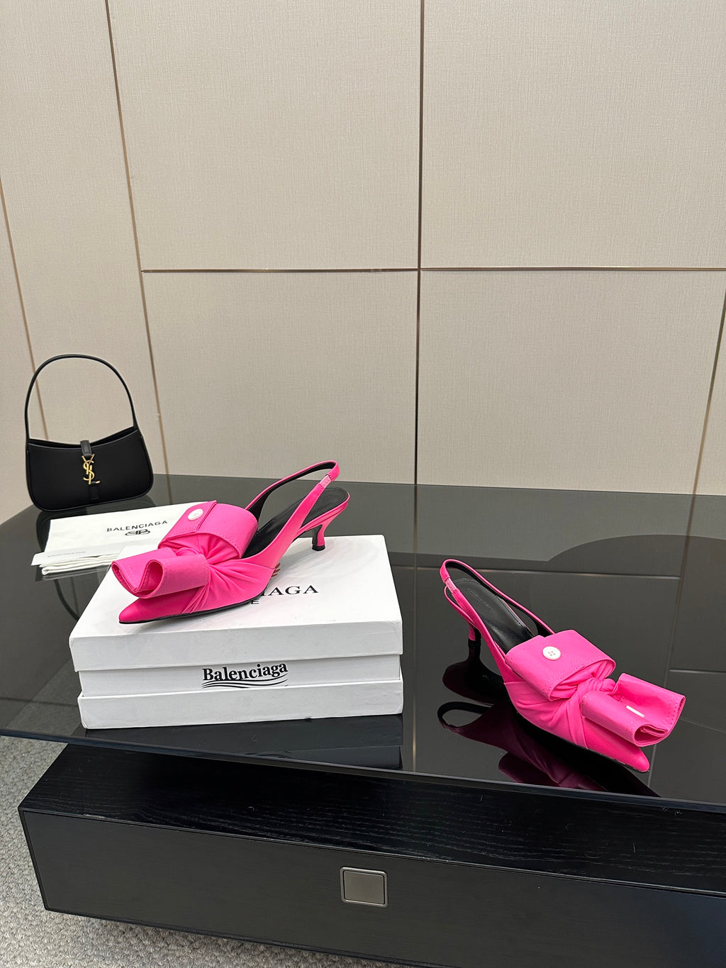 Pink bow mule sandals with stiletto heel, sling-back strap and bow front