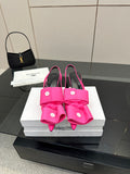 Pink bow mule sandals with stiletto heel and sling-back strap