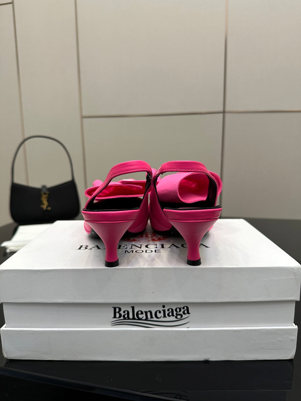 Pink mule sandals from back view, stiletto heel and bow straps