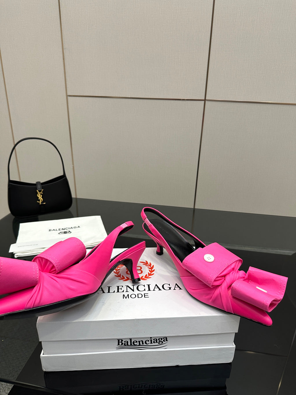 Pink bow mule sandals with stiletto heel, open back and sling-back strap