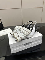 White Balenciaga women's heeled slingback sandals with striped bands and buckle
