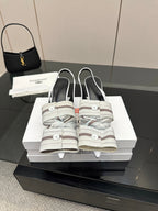 White Balenciaga women's heeled slingback sandals with buckle ankle strap