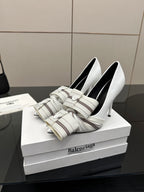 Balenciaga women\u2019s white heeled mules with striped band straps and buckles