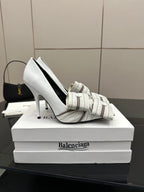Balenciaga women\u2019s white heeled mule shoe with striped strap and buckle, side view