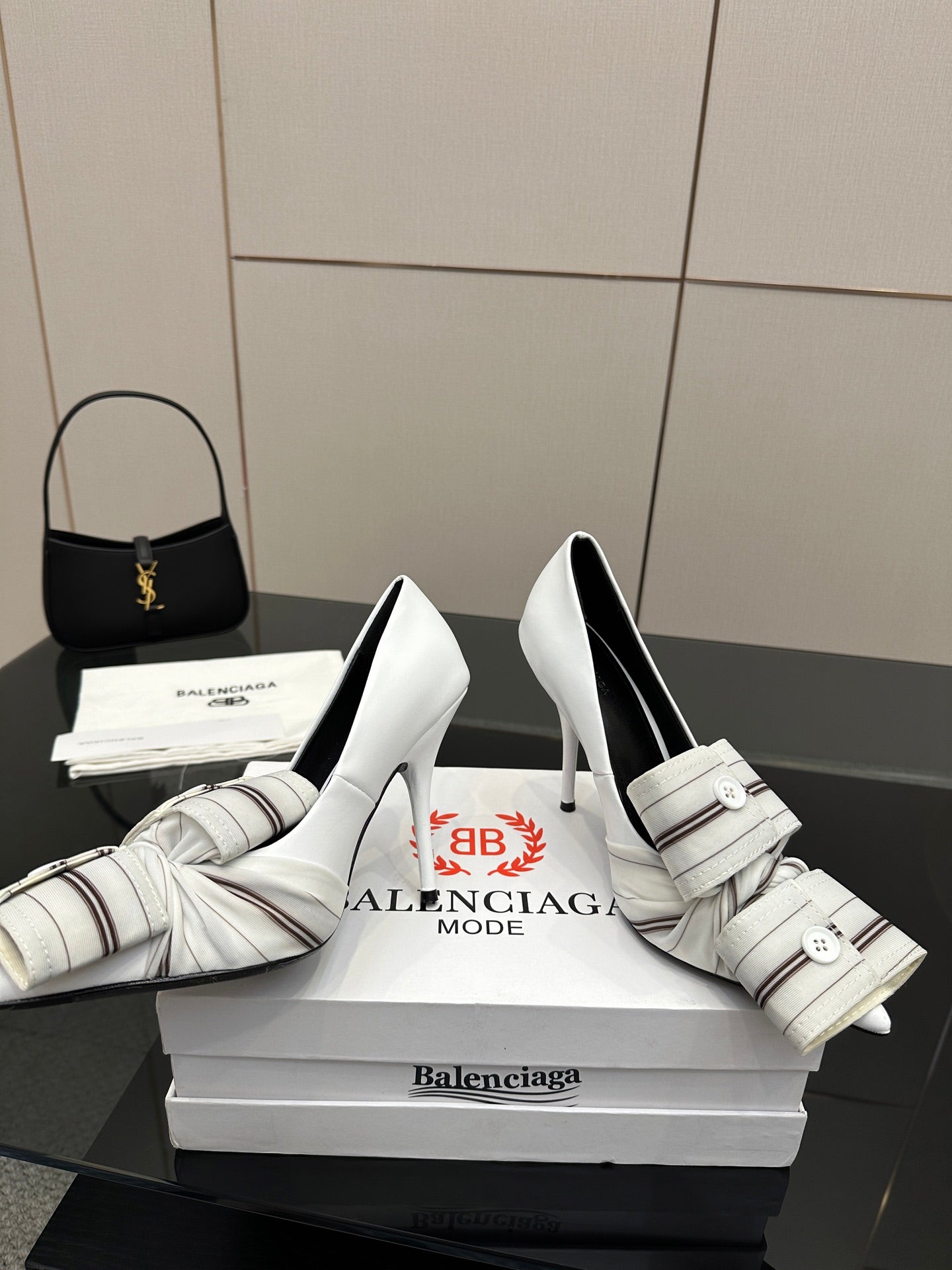 Balenciaga women\u2019s pointed-toe heeled mules with striped strap and buckle, white