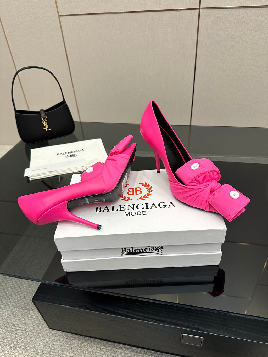 Pink stiletto heels with knotted bow detail and pointed toe