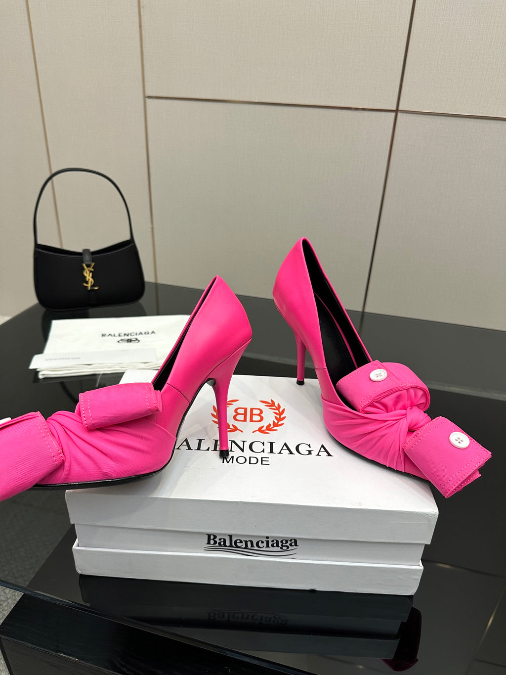 Pink stiletto heels with front bow detail and round button embellishments