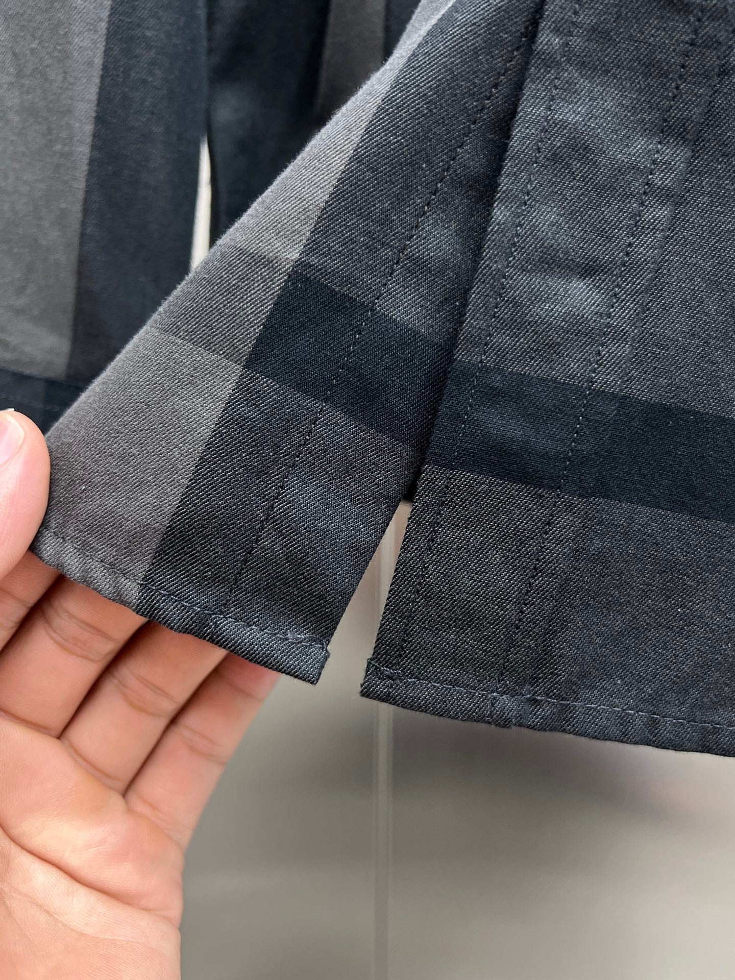 Burberry plaid shirt cuff hem with buttonhole detail, dark gray and navy check