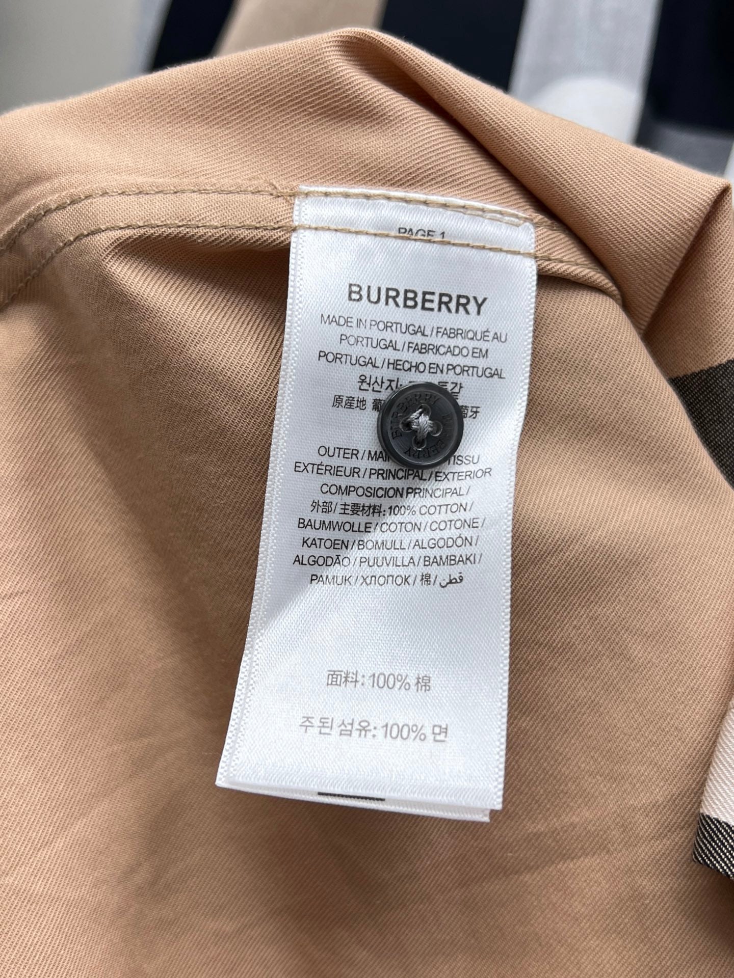 Burberry long-sleeve shirt neck label with fabric composition and country text