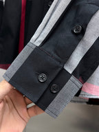 Burberry long-sleeve check shirt placket with buttons and gray-trim cuffs