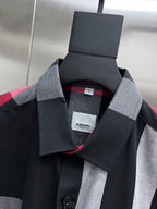 Plaid button-up shirt neckline with black and white checks and red trim