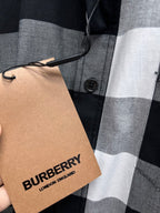 Black-and-white plaid button-up shirt with Burberry-branded hang tag