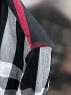 Plaid long-sleeve shirt with red-trimmed seam and black-and-white check pattern