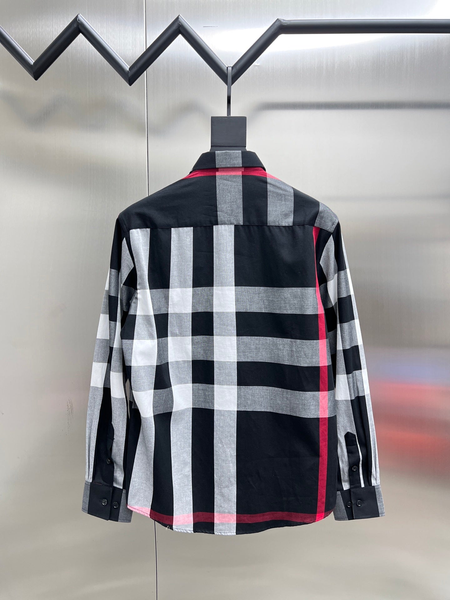 Black, white, and red plaid long-sleeve button-up shirt, back view