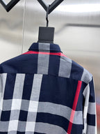 Long-sleeve plaid shirt on hanger with buttoned collar
