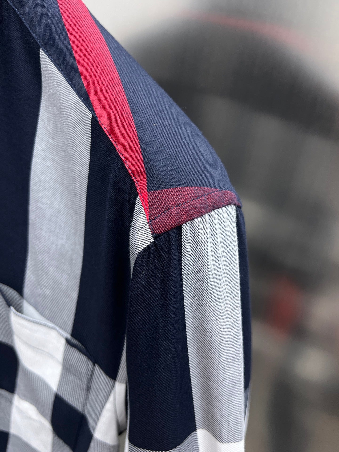 Burberry plaid shirt sleeve with red stripe and navy-and-white checks