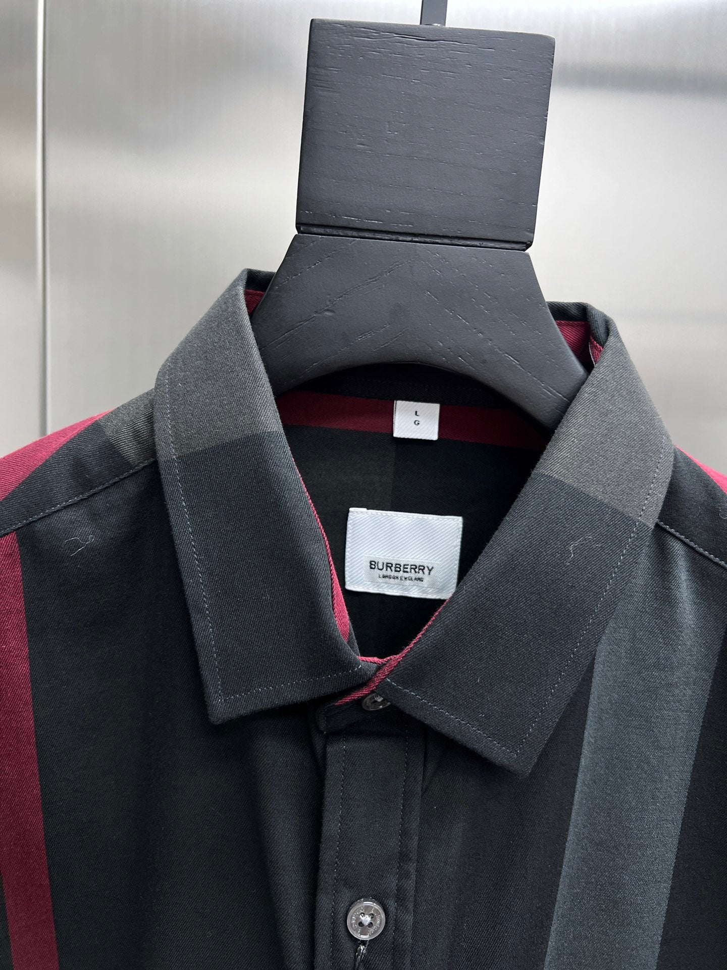 Burberry plaid button-up shirt collar detail, dark gray with button front