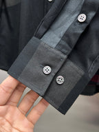 Dark plaid long-sleeve shirt cuff with two buttons and extended placket