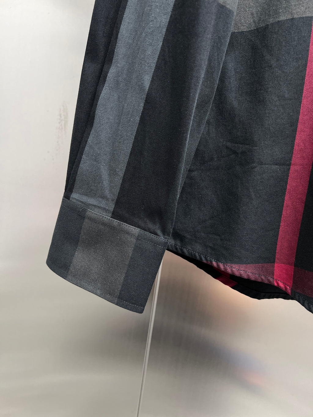 Burberry plaid button-up shirt hem and sleeve end, dark gray with red lines