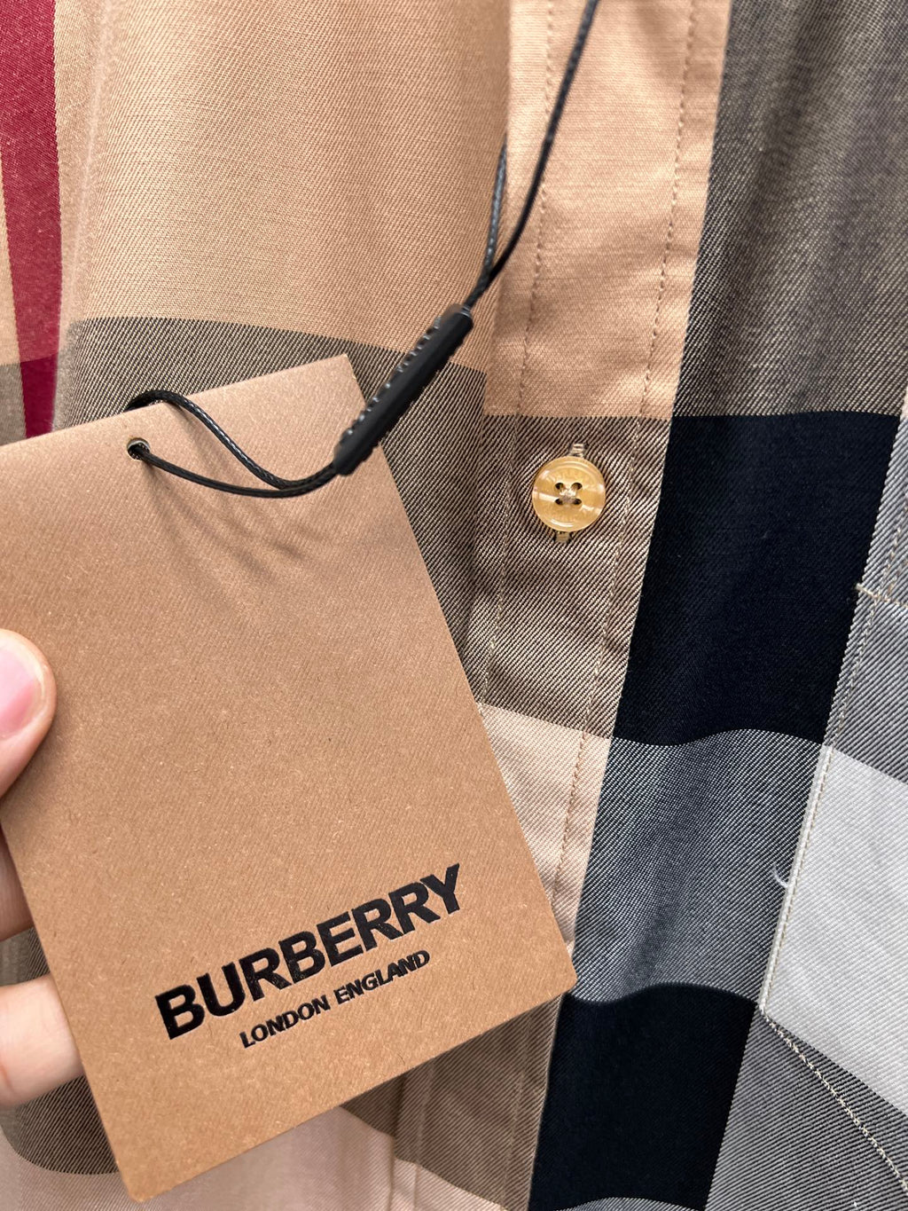 Burberry plaid long-sleeve shirt with hanging tag and gold button
