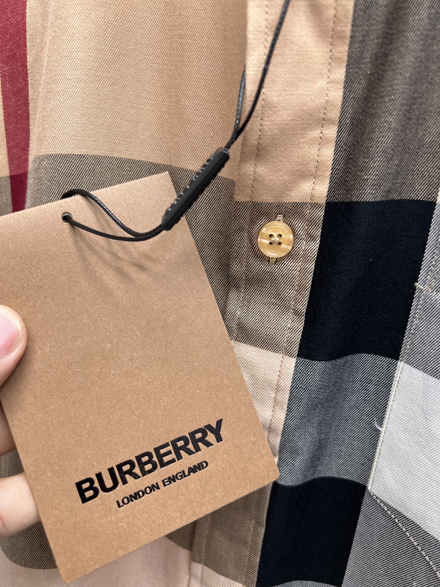 Burberry plaid long-sleeve shirt with hanging tag and gold button